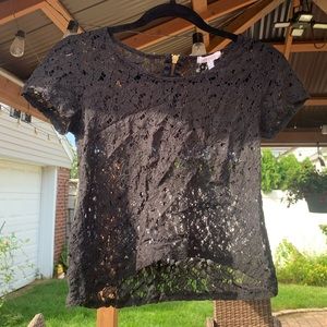 Delia’s black lace crop top with gold zipper detail